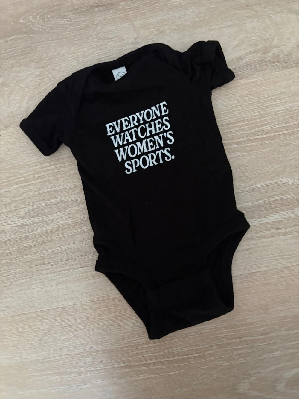 Black “everyone watches women’s sports” onesie - newborn